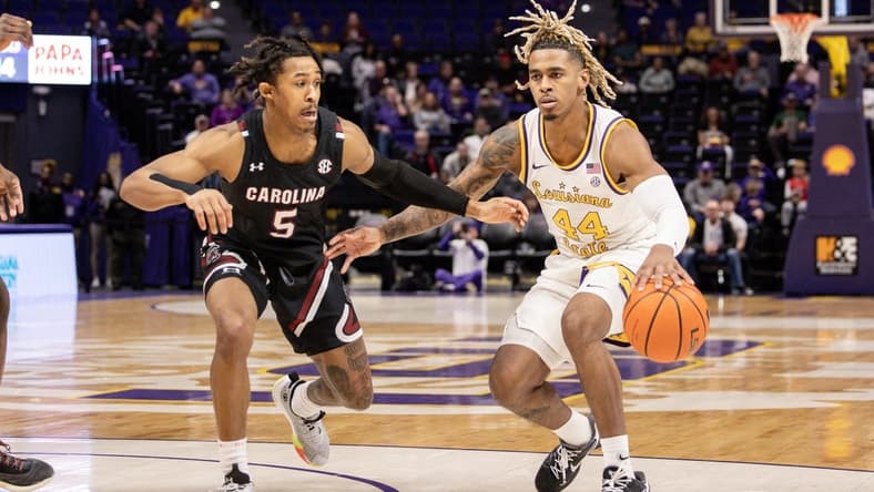 Feb 18, 2023; Baton Rouge, Louisiana, USA; LSU Tigers guard Adam Miller (44) dribbles against South Carolina Gamecocks guard Meechie Johnson (5) at Pete Maravich Assembly Center. Mandatory Credit: Stephen Lew-USA TODAY Sports