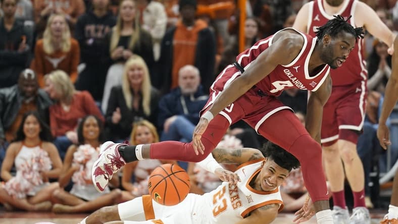 Feb 18, 2023; Austin, Texas, USA; Texas Longhorns forward Dillon Mitchell (23) and Oklahoma Sooners guard Joe Bamisile (4) battle for the loose ball during the first at Moody Center. Mandatory Credit: Scott Wachter-USA TODAY Sports