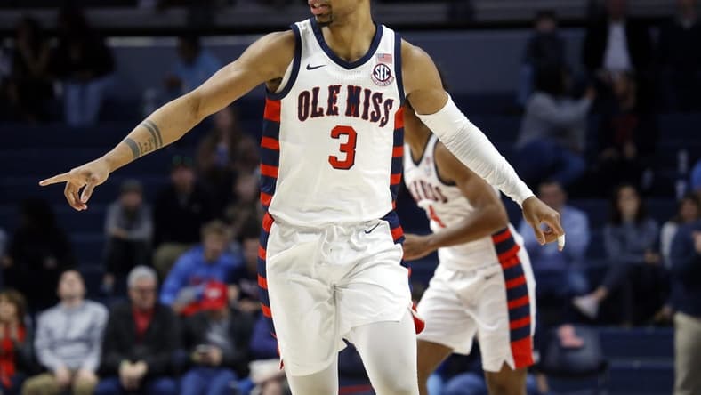 Feb 18, 2023; Oxford, Mississippi, USA; Mississippi Rebels forward Myles Burns (3) reacts after a basket during the first half against the Mississippi State Bulldogs at The Sandy and John Black Pavilion at Ole Miss. Mandatory Credit: Petre Thomas-USA TODAY Sports
