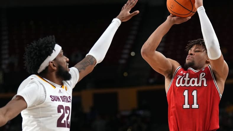 Feb 18, 2023; Tempe, Arizona, USA; Utah Utes guard Wilguens Exacte Jr. (11) shoots over Arizona State Sun Devils forward Warren Washington (22) during the first half at Desert Financial Arena. Mandatory Credit: Joe Camporeale-USA TODAY Sports