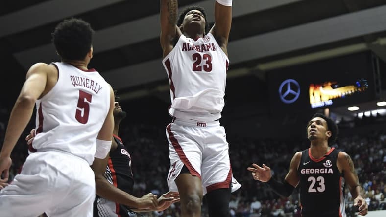 Feb 18, 2023; Tuscaloosa, Alabama, USA;  Alabama forward Nick Pringle (23) slams home a dunk against Georgia at Coleman Coliseum. Mandatory Credit: Gary Cosby Jr.-USA TODAY Sports