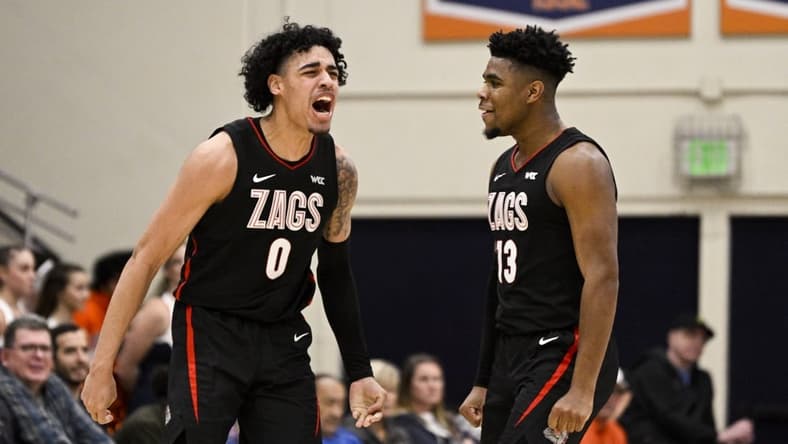 Feb 18, 2023; Malibu, California, USA; Gonzaga Bulldogs guard Julian Strawther (0) celebrates with guard Malachi Smith (13) after making a shot while being fouled against the Pepperdine Waves during the first half at Firestone Fieldhouse. Mandatory Credit: Kelvin Kuo-USA TODAY Sports