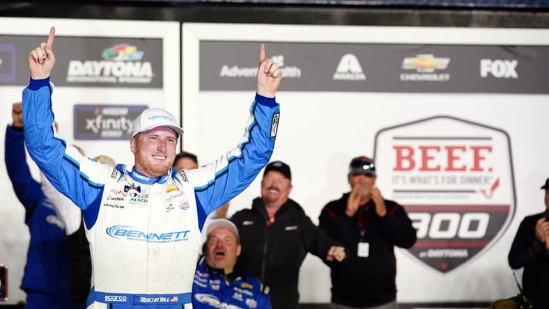 Feb 18, 2023; Daytona Beach, Florida, USA; Xfinity Series driver Austin Hill (21) celebrates in victory lane after winning the Beef It's What's For Dinner 300 race at Daytona International Speedway. Mandatory Credit: John David Mercer-USA TODAY Sports