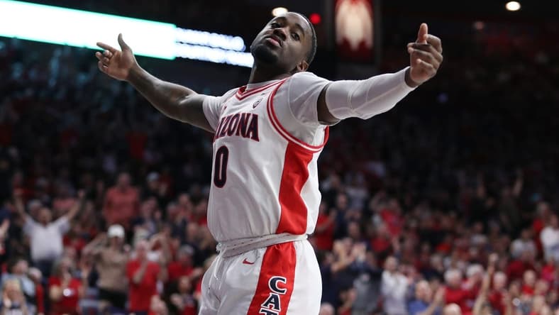 Feb 18, 2023; Tucson, Arizona, USA; Arizona Wildcats guard Courtney Ramey (0) celebrates after a three point basket during the first half at McKale Center. Mandatory Credit: Zachary BonDurant-USA TODAY Sports