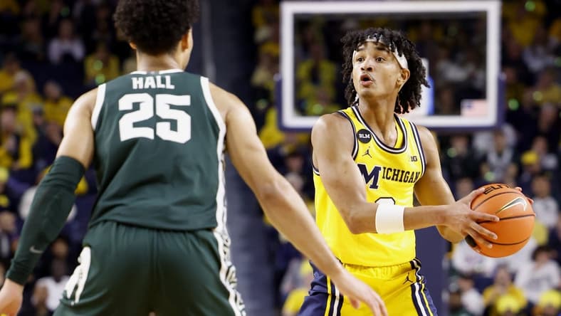 Feb 18, 2023; Ann Arbor, Michigan, USA; Michigan Wolverines guard Kobe Bufkin (2) controls the ball against Michigan State Spartans forward Malik Hall (25) in the first half at Crisler Center. Mandatory Credit: Rick Osentoski-USA TODAY Sports