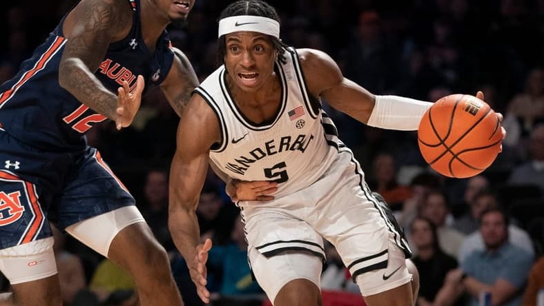 Vanderbilt guard Ezra Manjon (5) drives past Auburn guard Zep Jasper (12) during the first half at Memorial Gymnasium Saturday, Feb. 18, 2023, in Nashville, Tenn.

Ncaa Basketball Auburn At Vanderbilt