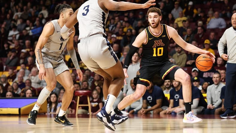Feb 18, 2023; Minneapolis, Minnesota, USA; Minnesota Golden Gophers forward Jamison Battle (10) dribbles the ball against Penn State Nittany Lions guard Seth Lundy (1) and forward Kebba Njie (3) during the first half at Williams Arena. Mandatory Credit: Matt Krohn-USA TODAY Sports
