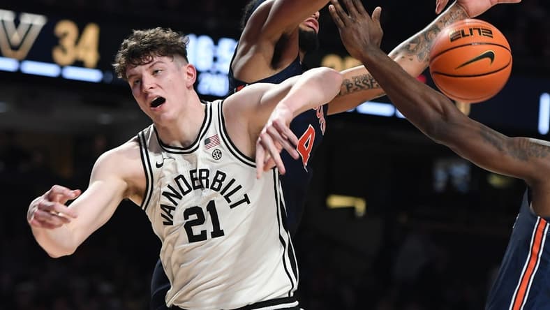 Feb 18, 2023; Nashville, Tennessee, USA; Vanderbilt Commodores forward Liam Robbins (21) is fouled on a rebound attempt during the second half against the Auburn Tigers at Memorial Gymnasium. Mandatory Credit: Christopher Hanewinckel-USA TODAY Sports