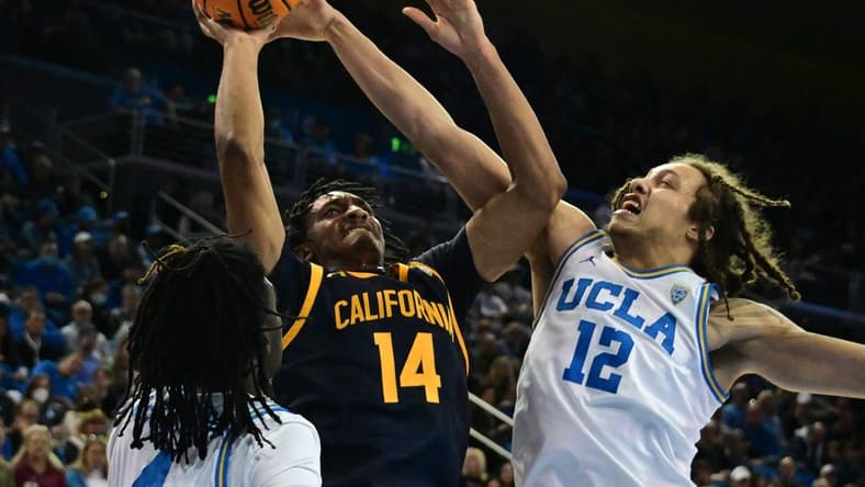 Feb 18, 2023; Los Angeles, California, USA; California Golden Bears forward Grant Newell (14) shoots against UCLA Bruins forward Mac Etienne (12)  in a college basketball game at Pauley Pavilion presented by Wescom. Mandatory Credit: Richard Mackson-USA TODAY Sports