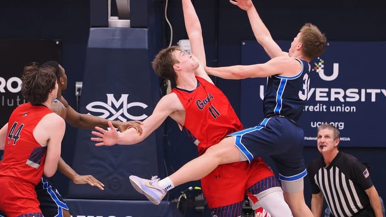 Feb 18, 2023; Moraga, California, USA; BYU Cougars guard Dallin Hall (30) shoots the ball against St. Mary's Gaels center Mitchell Saxen (11) during the first half at University Credit Union Pavilion. Mandatory Credit: Kelley L Cox-USA TODAY Sports