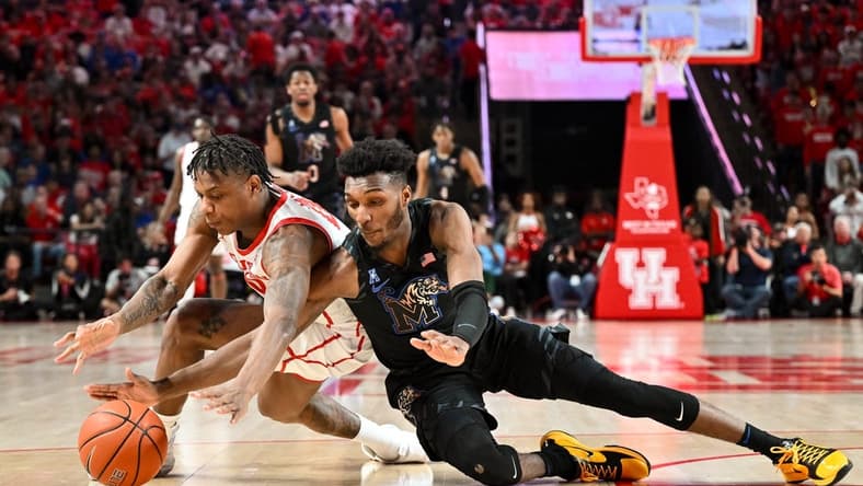 Feb 19, 2023; Houston, Texas, USA; Houston Cougars guard Marcus Sasser (0) and Memphis Tigers guard Keonte Kennedy (1) scrambles for a loose ball during the first half at Fertitta Center. Mandatory Credit: Maria Lysaker-USA TODAY Sports