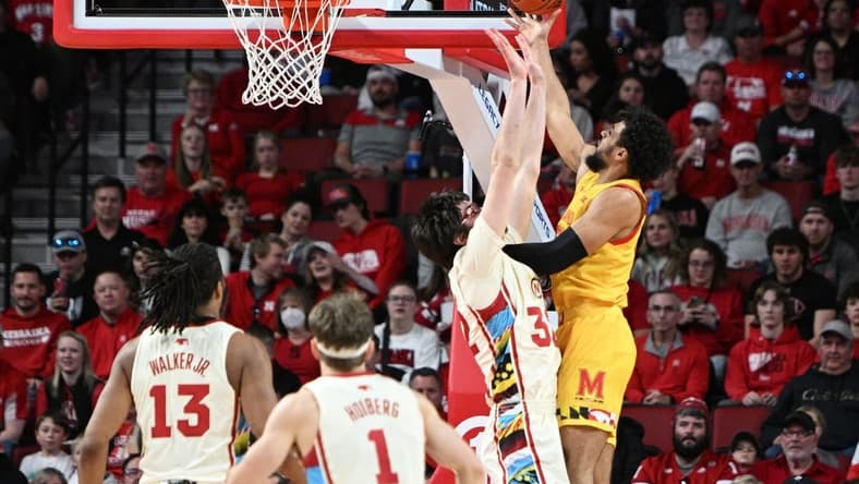 Feb 19, 2023; Lincoln, Nebraska, USA; Maryland Terrapins forward Patrick Emilien (15) attempts a shot over Nebraska Cornhuskers forward Wilhelm Breidenbach (32) in the first half at Pinnacle Bank Arena. Mandatory Credit: Steven Branscombe-USA TODAY Sports