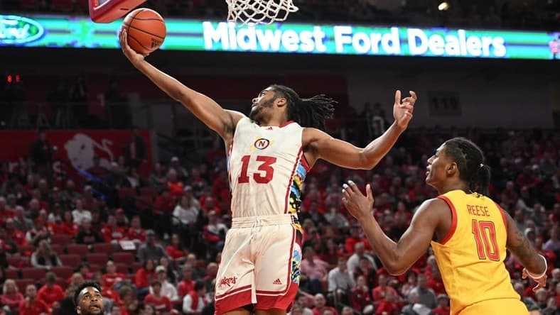 Feb 19, 2023; Lincoln, Nebraska, USA; Nebraska Cornhuskers forward Derrick Walker (13) reaches for a loose ball against Maryland Terrapins forward Julian Reese (10) in the first half at Pinnacle Bank Arena. Mandatory Credit: Steven Branscombe-USA TODAY Sports