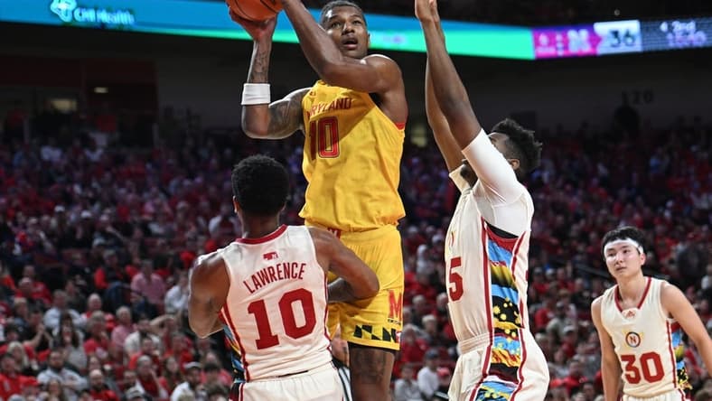 Feb 19, 2023; Lincoln, Nebraska, USA; Maryland Terrapins forward Julian Reese (10) attempt a shot against Nebraska Cornhuskers guard Jamarques Lawrence (10) and forward Blaise Keita (15) in the second half at Pinnacle Bank Arena. Mandatory Credit: Steven Branscombe-USA TODAY Sports