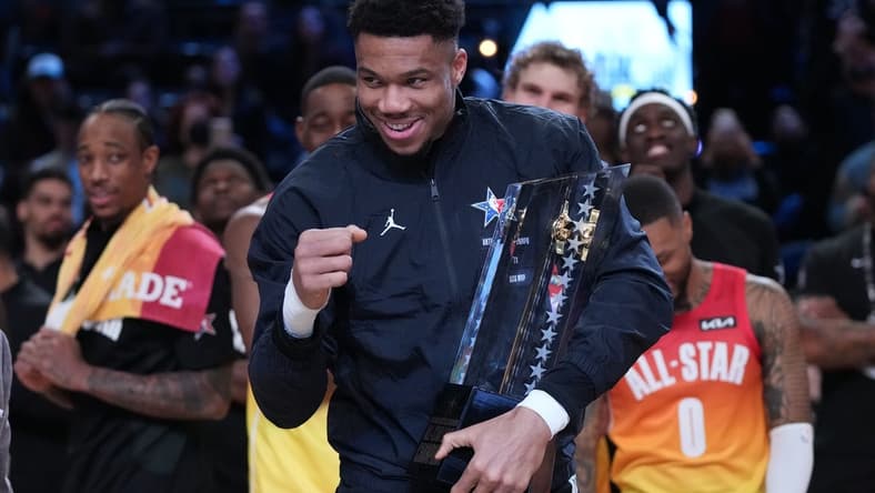 Feb 19, 2023; Salt Lake City, UT, USA; Team Giannis forward Giannis Antetokounmpo (34) celebrates with the NBA All-Star Game Trophy after the 2023 NBA All-Star Game at Vivint Arena. Mandatory Credit: Kyle Terada-USA TODAY Sports