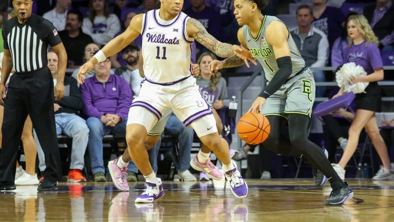 Feb 21, 2023; Manhattan, Kansas, USA; Baylor Bears guard Keyonte George (1) is guarded by Kansas State Wildcats guard Keyontae Johnson (11) during the first half at Bramlage Coliseum. Mandatory Credit: Scott Sewell-USA TODAY Sports