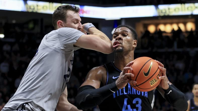 Feb 21, 2023; Cincinnati, Ohio, USA; Xavier Musketeers forward Jack Nunge (24) defends against Villanova Wildcats forward Eric Dixon (43) in the second half at the Cintas Center. Mandatory Credit: Aaron Doster-USA TODAY Sports