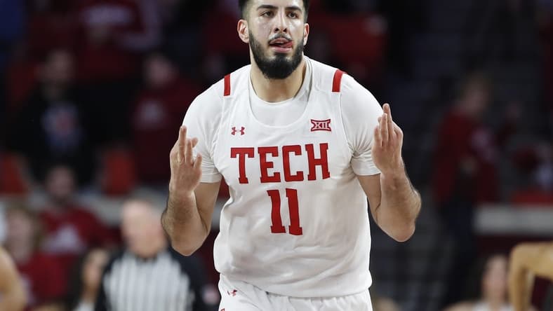Feb 21, 2023; Norman, Oklahoma, USA; Texas Tech Red Raiders forward Fardaws Aimaq (11) gestures after scoring a three point basket against the Oklahoma Sooners during the second half at Lloyd Noble Center. Texas Tech won 74-63. Mandatory Credit: Alonzo Adams-USA TODAY Sports