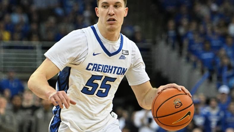 Feb 21, 2023; Omaha, Nebraska, USA; Creighton Bluejays guard Baylor Scheierman (55) dribbles against the Marquette Golden Eagles in the second half at CHI Health Center Omaha. Mandatory Credit: Steven Branscombe-USA TODAY Sports