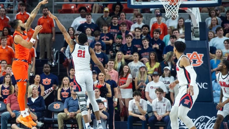 Auburn Tigers forward Johni Broome (4) shoots a hook shot as Auburn Tigers take on Ole Miss Rebels at Neville Arena in Auburn, Ala., on Wednesday, Feb. 22, 2023.