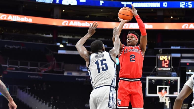 Feb 22, 2023; Washington, District of Columbia, USA; St. John's Red Storm guard AJ Storr (2) shoots over Georgetown Hoyas forward Bryson Mozone (15) during the first half at Capital One Arena. Mandatory Credit: Brad Mills-USA TODAY Sports