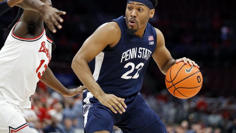 Feb 23, 2023; Columbus, Ohio, USA; Penn State Nittany Lions guard Jalen Pickett (22) dribbles past Ohio State Buckeyes guard Isaac Likekele (13) during the first half at Value City Arena. Mandatory Credit: Joseph Maiorana-USA TODAY Sports