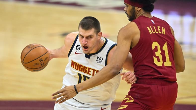 Feb 23, 2023; Cleveland, Ohio, USA; Denver Nuggets center Nikola Jokic (15) fights for position against Cavaliers center Jarrett Allen (31) in the first quarter at Rocket Mortgage FieldHouse. Mandatory Credit: David Richard-USA TODAY Sports