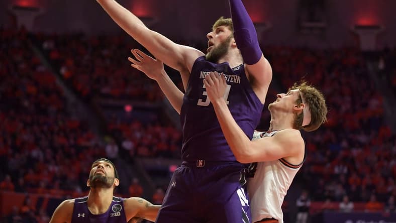 Feb 23, 2023; Champaign, Illinois, USA;  Northwestern Wildcats center Matthew Nicholson (34) grabs a rebound in front of Illinois Fighting Illini forward Matthew Mayer (24) during the first half at State Farm Center. Mandatory Credit: Ron Johnson-USA TODAY Sports