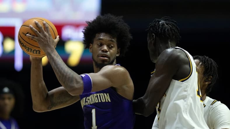 Feb 23, 2023; Berkeley, California, USA; Washington Huskies forward Keion Brooks Jr. (1) looks to pass around California Golden Bears forward Kuany Kuany (13) during the first half at Haas Pavilion. Mandatory Credit: D. Ross Cameron-USA TODAY Sports
