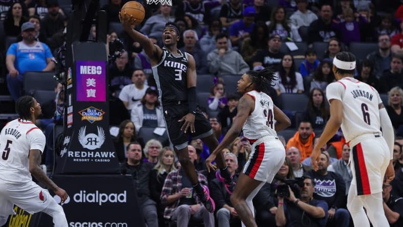 Feb 23, 2023; Sacramento, California, USA; Sacramento Kings guard Terence Davis (3) drives to the basket against Portland Trail Blazers forward Jabari Walker (34) during the second quarter at Golden 1 Center. Mandatory Credit: Sergio Estrada-USA TODAY Sports