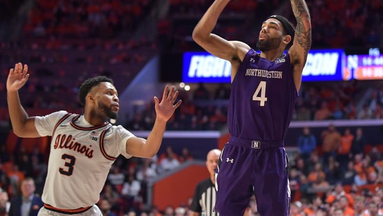 Feb 23, 2023; Champaign, Illinois, USA; Northwestern Wildcats guard Boo Buie (4) shoots the ball past Illinois Fighting Illini guard Jayden Epps (3) during the second half at State Farm Center. Mandatory Credit: Ron Johnson-USA TODAY Sports