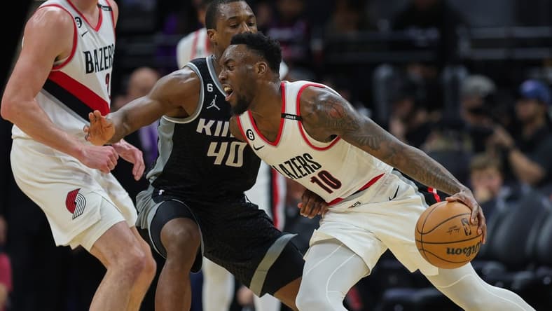 Feb 23, 2023; Sacramento, California, USA; Portland Trail Blazers forward Nassir Little (10) dribbles the ball against Sacramento Kings forward Harrison Barnes (40) during the third quarter at Golden 1 Center. Mandatory Credit: Sergio Estrada-USA TODAY Sports