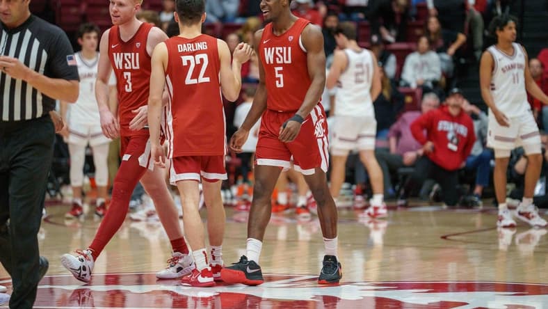 Feb 23, 2023; Stanford, California, USA; Washington State Cougars guard Dylan Darling (22) and Washington State Cougars guard Jabe Mullins (3) and Washington State Cougars guard TJ Bamba (5) celebrate after the game against the Stanford Cardinal during the second half at Maples Pavilion. Mandatory Credit: Neville E. Guard-USA TODAY Sports