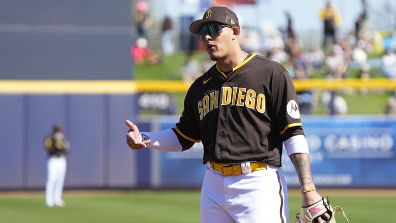 Feb 24, 2023; Peoria, Arizona, USA; San Diego Padres third baseman Manny Machado (13) talks to an umpire in the first inning during a spring training game against the Seattle Mariners at Peoria Sports Complex. Mandatory Credit: Rick Scuteri-USA TODAY Sports