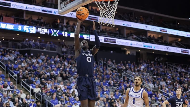 Feb 24, 2023; Newark, New Jersey, USA; Xavier Musketeers guard Souley Boum (0) shoots the ball in front of Seton Hall Pirates forward Tray Jackson (1) during the first half at Prudential Center. Mandatory Credit: Vincent Carchietta-USA TODAY Sports