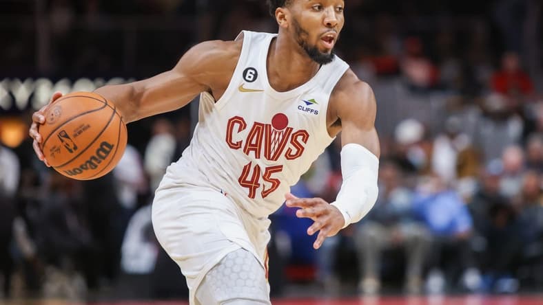 Feb 24, 2023; Atlanta, Georgia, USA; Cleveland Cavaliers guard Donovan Mitchell (45) dribbles against the Atlanta Hawks in the first quarter at State Farm Arena. Mandatory Credit: Brett Davis-USA TODAY Sports