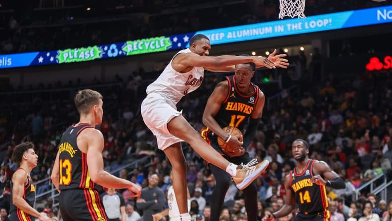 Feb 24, 2023; Atlanta, Georgia, USA; Cleveland Cavaliers forward Evan Mobley (4) and Atlanta Hawks forward Onyeka Okongwu (17) reach for a rebound in the second quarter at State Farm Arena. Mandatory Credit: Brett Davis-USA TODAY Sports