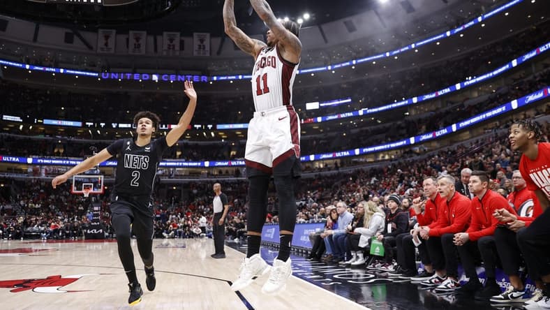 Feb 24, 2023; Chicago, Illinois, USA; Chicago Bulls forward DeMar DeRozan (11) shoots against the Brooklyn Nets during the first half at United Center. Mandatory Credit: Kamil Krzaczynski-USA TODAY Sports