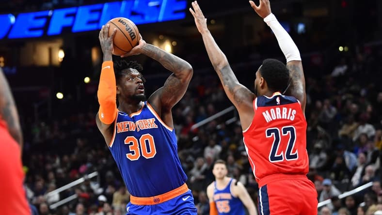 Feb 24, 2023; Washington, District of Columbia, USA; New York Knicks forward Julius Randle (30) shoots over Washington Wizards guard Monte Morris (22) during the first half at Capital One Arena. Mandatory Credit: Brad Mills-USA TODAY Sports