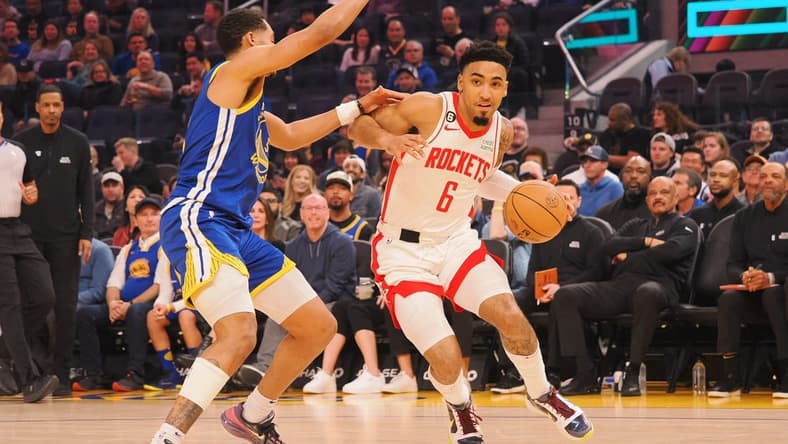 Feb 24, 2023; San Francisco, California, USA; Houston Rockets KJ Martin Jr. (6) is fouled by Golden State Warriors Jordan Poole (3) during the first quarter at Chase Center. Mandatory Credit: Kelley L Cox-USA TODAY Sports
