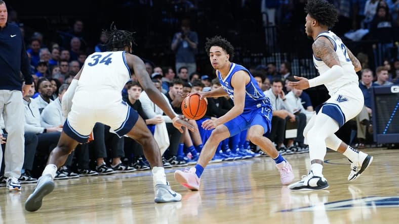 Feb 25, 2023; Philadelphia, Pennsylvania, USA; Creighton Bluejays guard Ryan Nembhard (2) dribbles the ball against Villanova Wildcats forward Brandon Slater (34) an d forward Cam Whitmore (22) during the first half at Wells Fargo Center. Mandatory Credit: Gregory Fisher-USA TODAY Sports