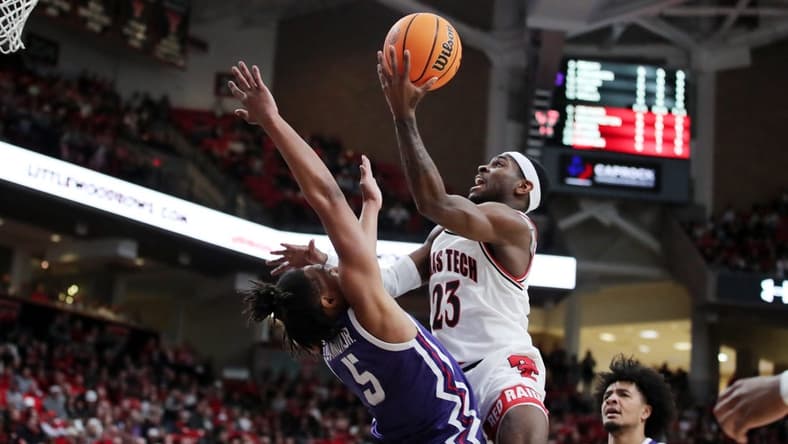Feb 25, 2023; Lubbock, Texas, USA; Texas Tech Red Raiders guard De   Vion Harmon (23) drives to the basket against TCU Horned Frogs forward Chuck O   Bannon Jr. (5) in the first half at United Supermarkets Arena. Mandatory Credit: Michael C. Johnson-USA TODAY Sports