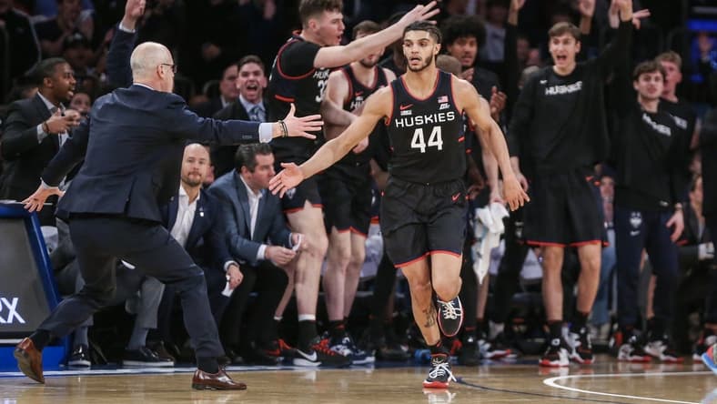 Feb 25, 2023; New York, New York, USA;  Connecticut Huskies guard Andre Jackson Jr. (44) celebrates with head coach Dan Hurley after making a three point shot against the St. John's Red Storm in the second half at Madison Square Garden. Mandatory Credit: Wendell Cruz-USA TODAY Sports