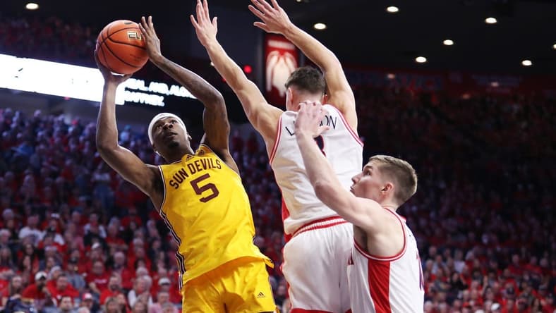 Feb 25, 2023; Tucson, Arizona, USA; Arizona State Sun Devils forward Jamiya Neal (5) shoots the ball against Arizona Wildcats guard Pelle Larsson (3) and forward Azuolas Tubelis (10) in the first half at McKale Center. Mandatory Credit: Zachary BonDurant-USA TODAY Sports