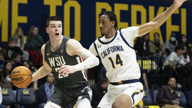 February 25, 2023; Berkeley, California, USA; Washington State Cougars forward Andrej Jakimovski (23) dribbles the basketball against California Golden Bears forward Grant Newell (14) during the first half at Haas Pavilion. Mandatory Credit: Kyle Terada-USA TODAY Sports