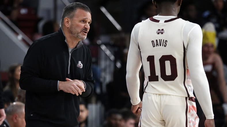 Feb 25, 2023; Starkville, Mississippi, USA; Mississippi State Bulldogs head coach Chris Jans (left) talks with guard Dashawn Davis (10) during the second half against the Texas A&M Aggies at Humphrey Coliseum. Mandatory Credit: Petre Thomas-USA TODAY Sports
