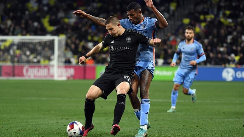 Feb 25, 2023; Nashville, Tennessee, USA;  Nashville SC midfielder Alex Muyl (19) and New York City FC forward Thiago (8) battle for the ball in the second half at Geodis Park. Mandatory Credit: Christopher Hanewinckel-USA TODAY Sports