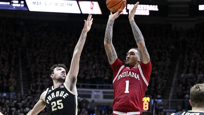 Feb 25, 2023; West Lafayette, Indiana, USA; Indiana Hoosiers guard Jalen Hood-Schifino (1) shoots the ball against Purdue Boilermakers guard Ethan Morton (25) during the first half at Mackey Arena. Mandatory Credit: Marc Lebryk-USA TODAY Sports