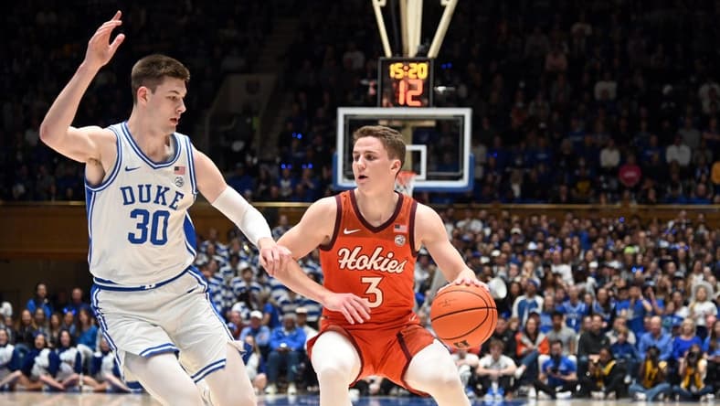 Feb 25, 2023; Durham, North Carolina, USA; Virginia Tech Hokies guard Sean Pedulla (3) controls the ball in front of Duke Blue Devils center Kyle Filipowski (30) during the first half at Cameron Indoor Stadium. Mandatory Credit: Rob Kinnan-USA TODAY Sports