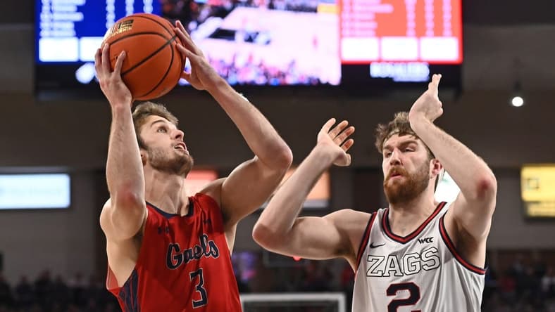 Feb 25, 2023; Spokane, Washington, USA; St. Mary's Gaels guard Augustas Marciulionis (3) shoots against Gonzaga Bulldogs forward Drew Timme (2) in the first half at McCarthey Athletic Center. Mandatory Credit: James Snook-USA TODAY Sports